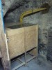 Chaudière à granulés ETA PU 7kW - silo de stockage 1t. sous escalier